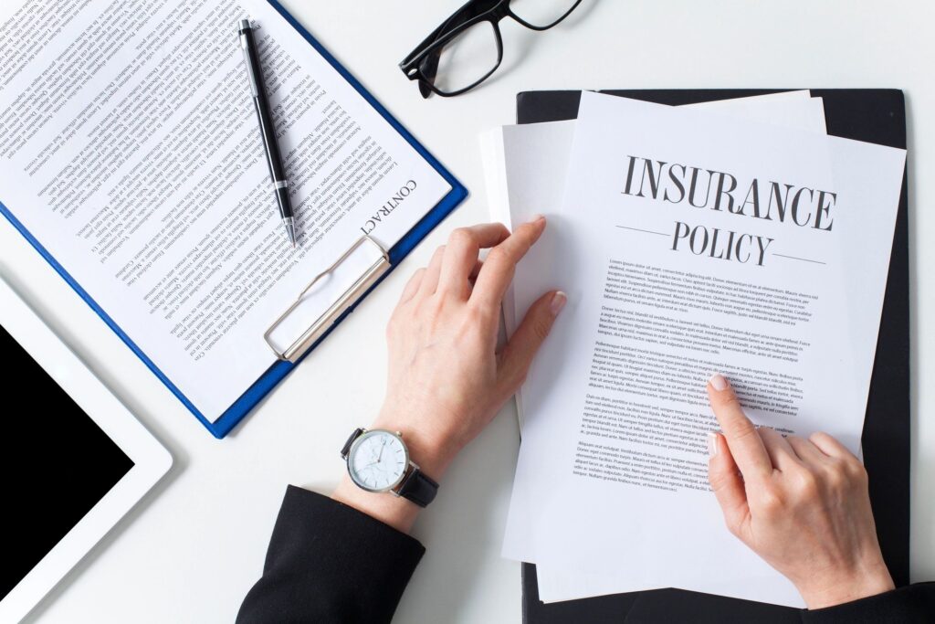 Businesswoman presenting insurance policy document — Legacy Wealth Strategies life insurance and tax-free wealth solutions