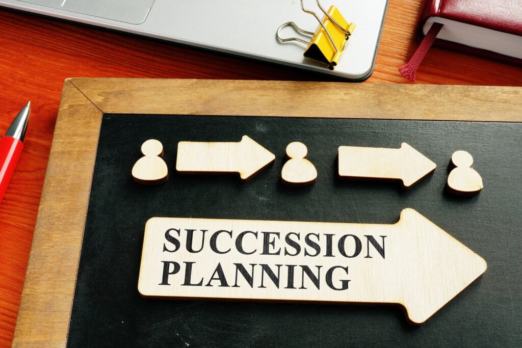 Business succession planning concept with wooden blocks — Legacy Wealth Strategies solutions for business owners